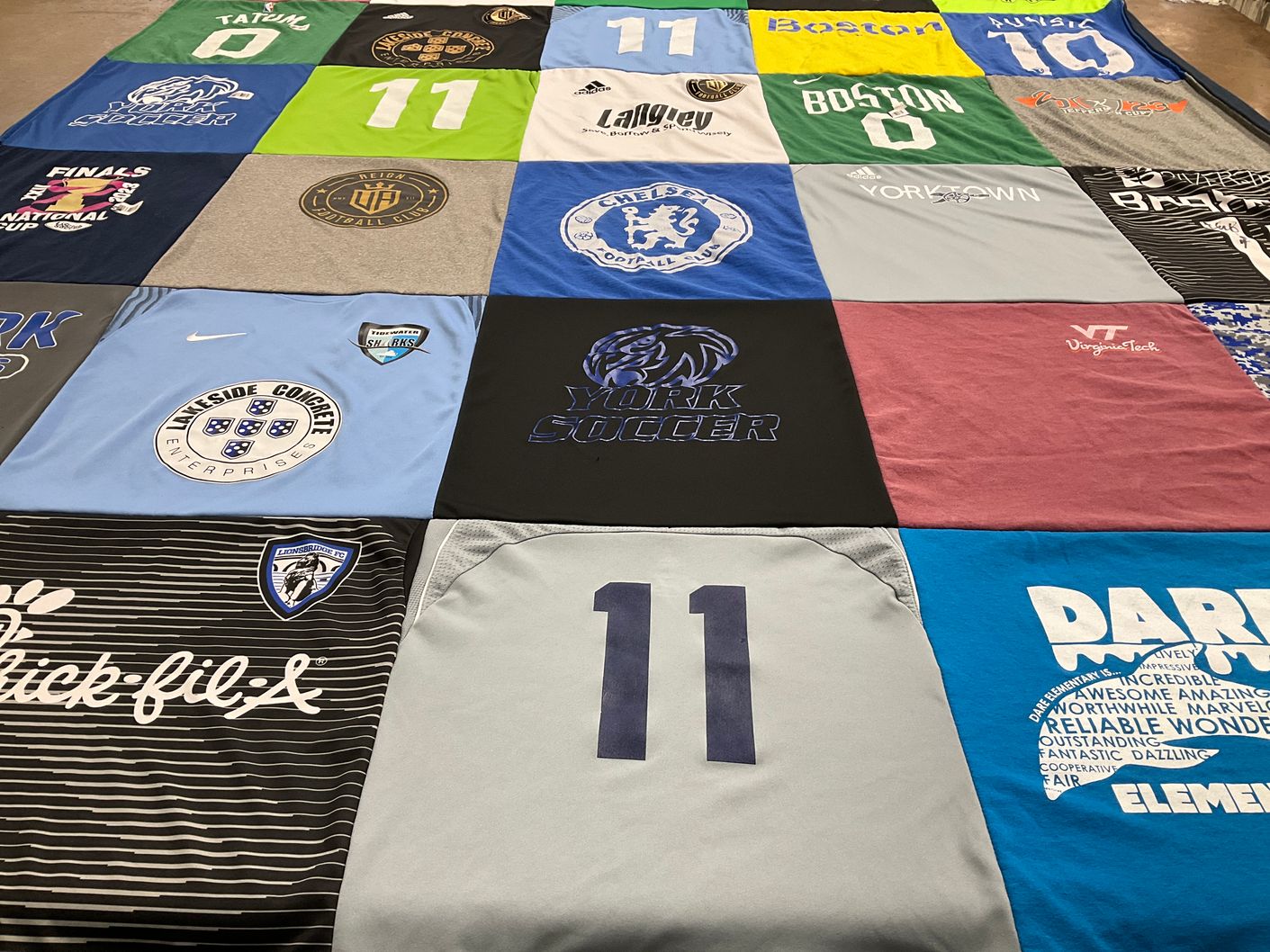 T-shirt quilt featuring sharks, lions soccer team by Jen from VA