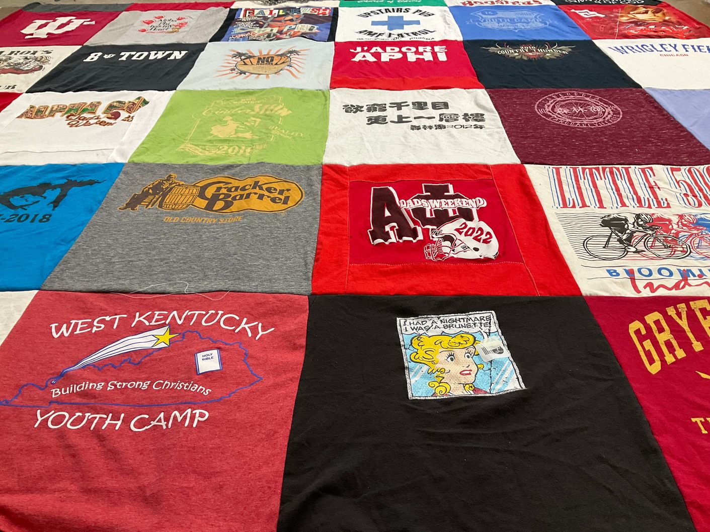 T-shirt quilt with camping, sports themes by Mandy from IL
