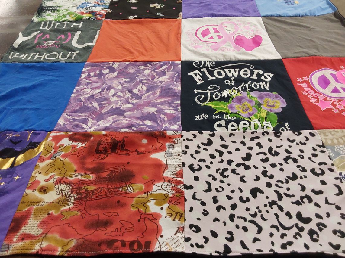 T-shirt quilt with peace, nature themes by Maxine from OH