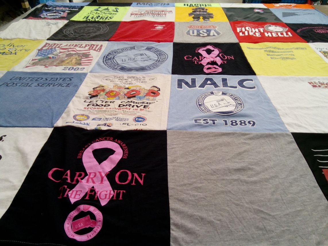 T-shirt quilt with cancer awareness, food drives themes by Rebekah from AL