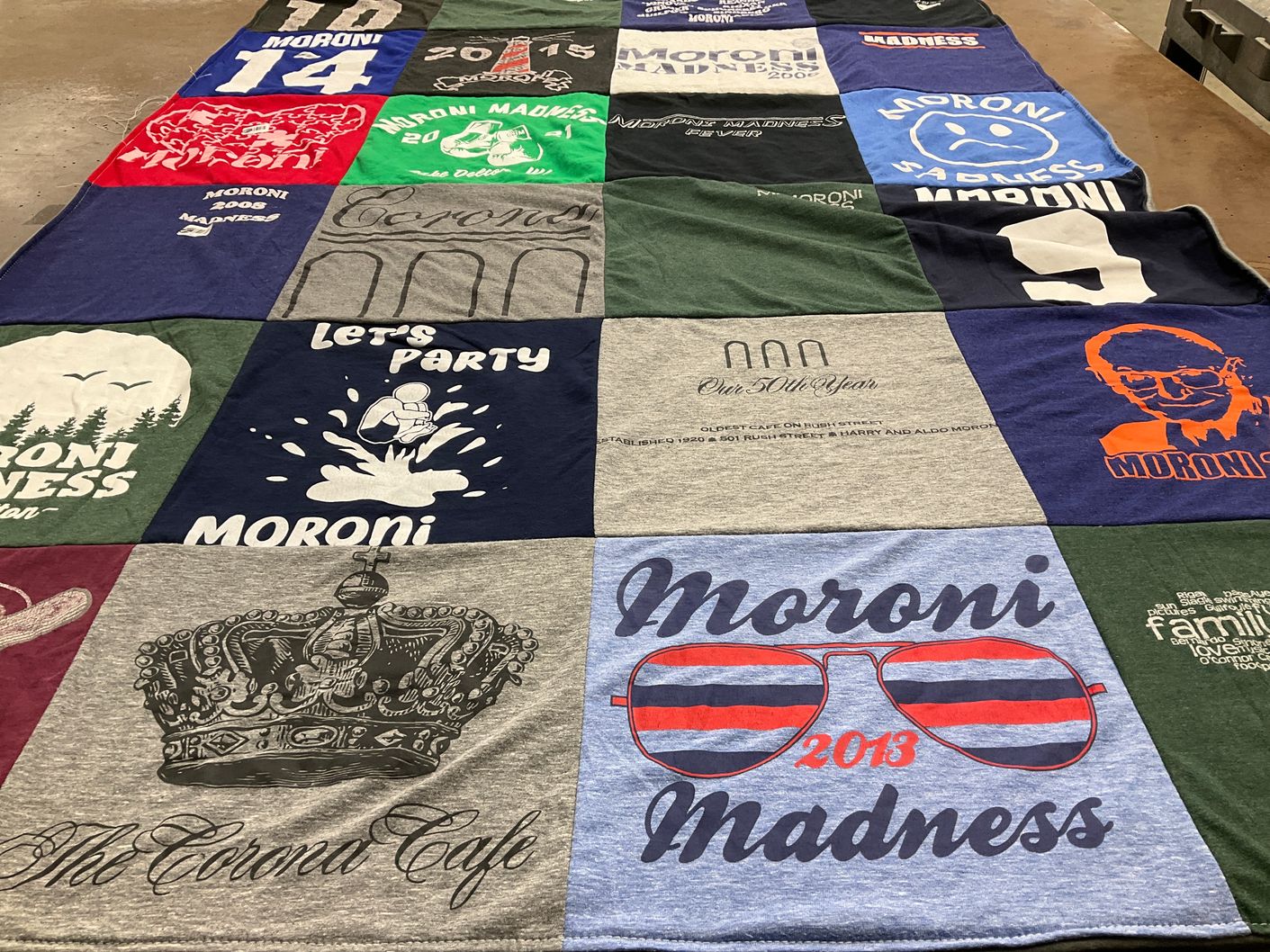 T-shirt quilt with events, community gatherings themes by Leah from WI