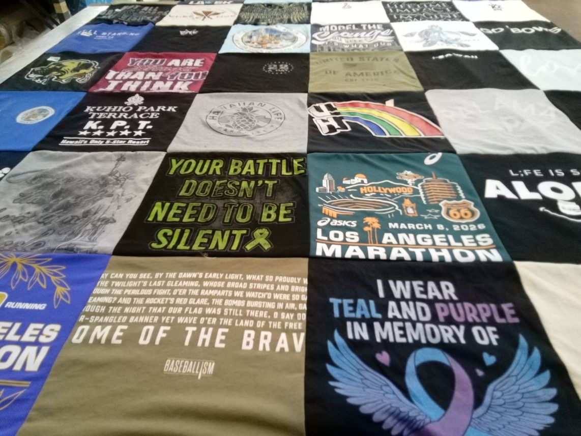 T-shirt quilt with running themes by Terrie from CA