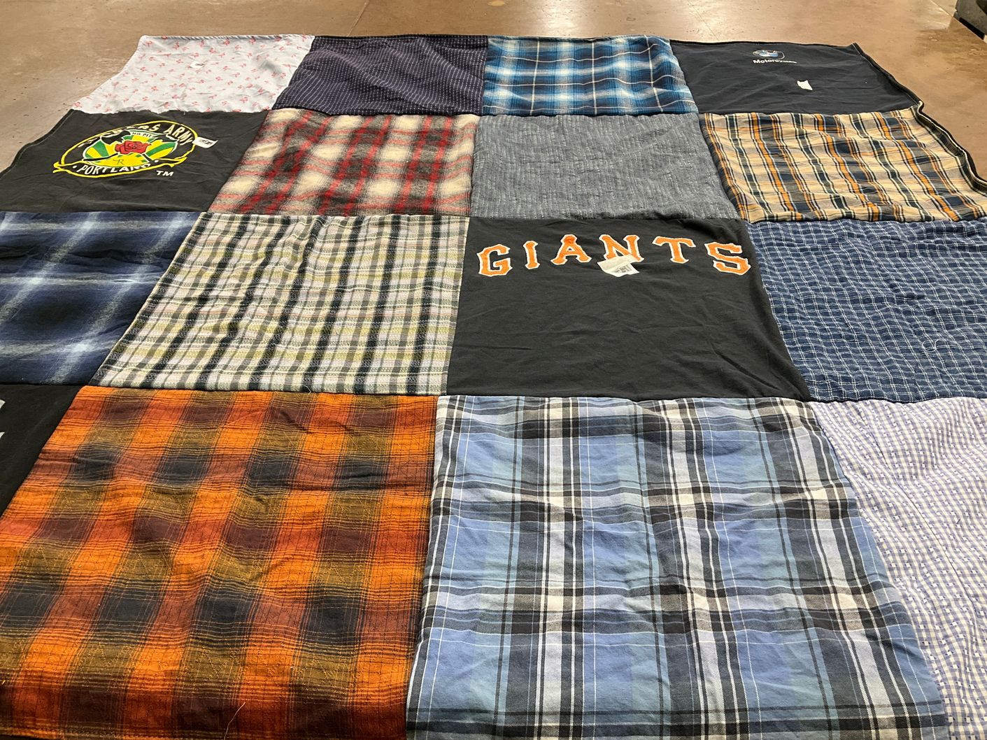 T-shirt quilt with sports themes by Jane from OR