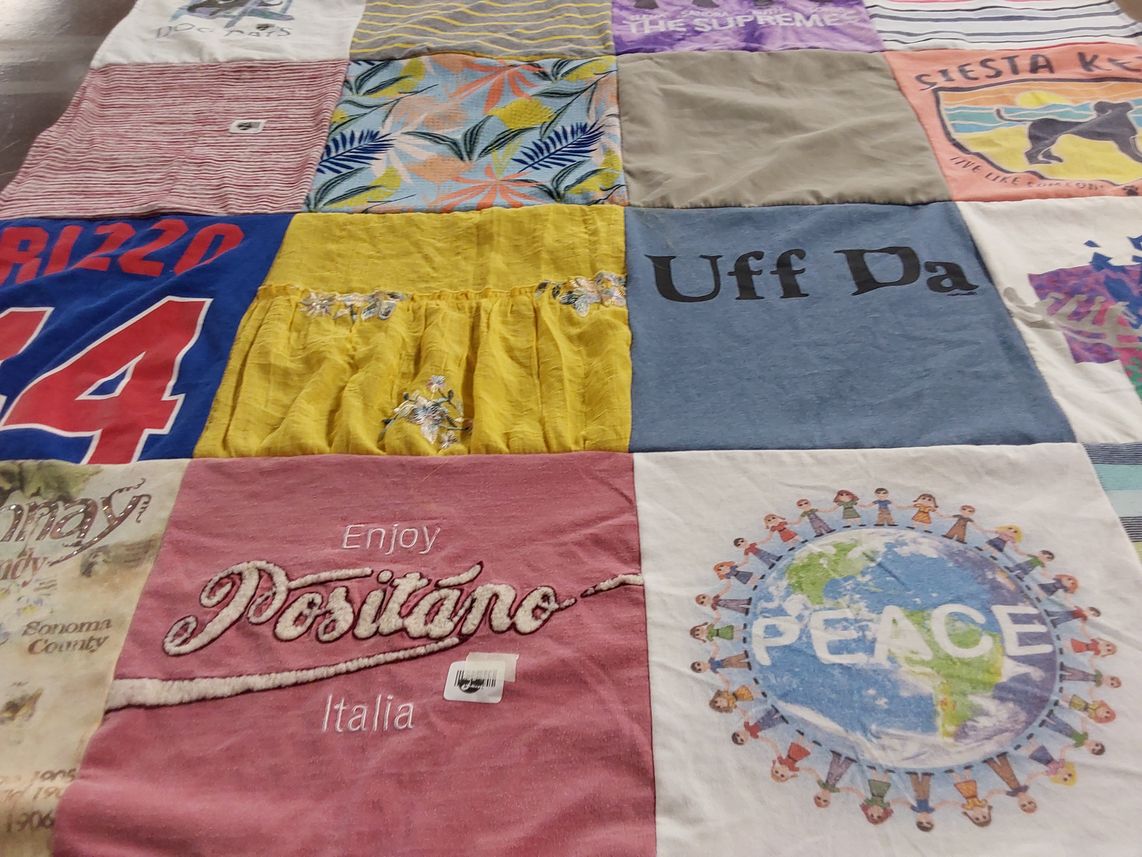 T-shirt quilt with travel, cultural themes by Kristin from WI