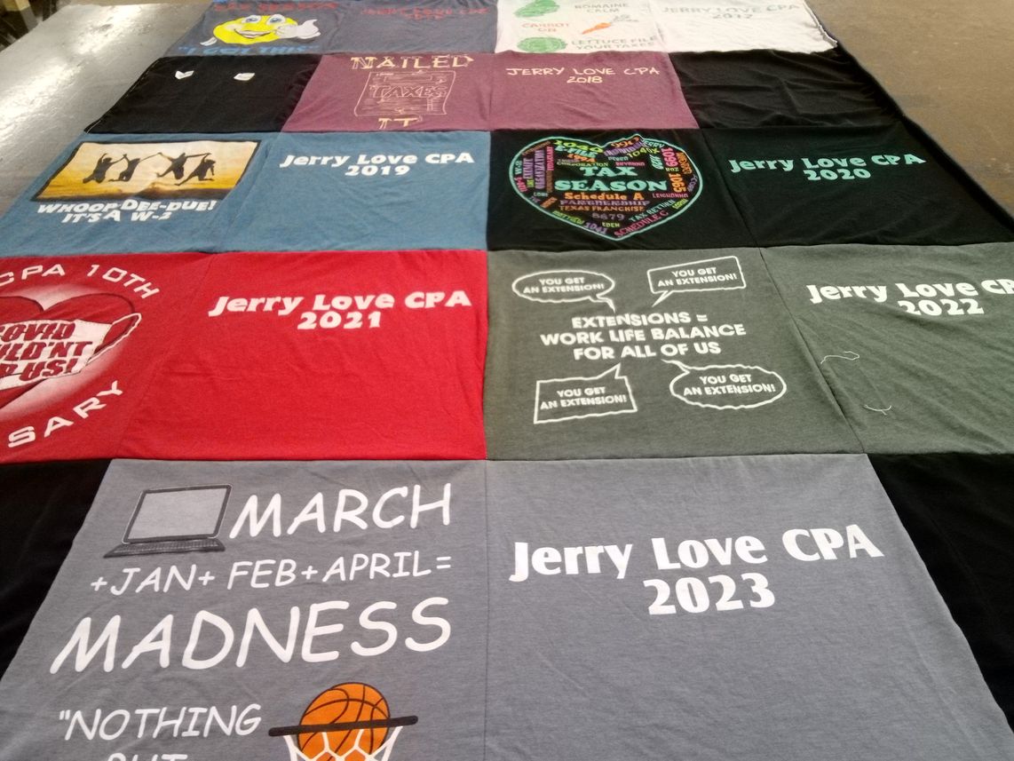 T-shirt quilt with accounting, taxes themes by Bryanna from TX