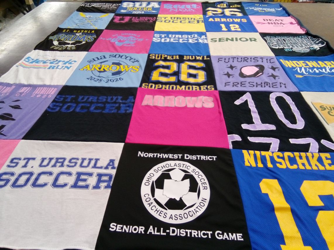T-shirt quilt featuring st. ursula academy arrows by Monica from OH