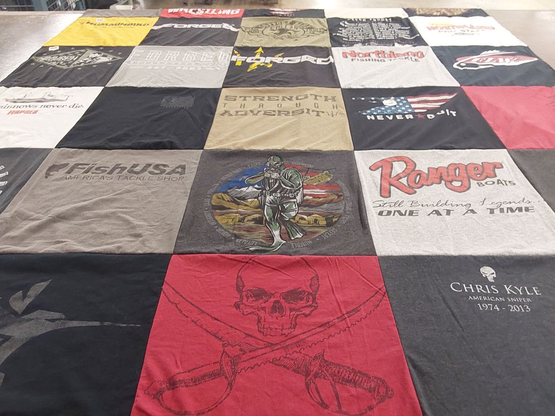 T-shirt quilt with fishing, hunting themes by LAURA from WI