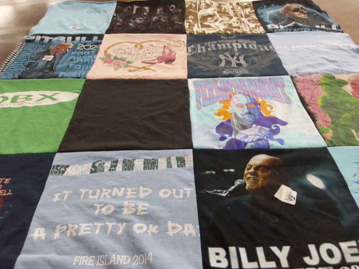 T-shirt quilt with music, concerts themes by Susan from NY