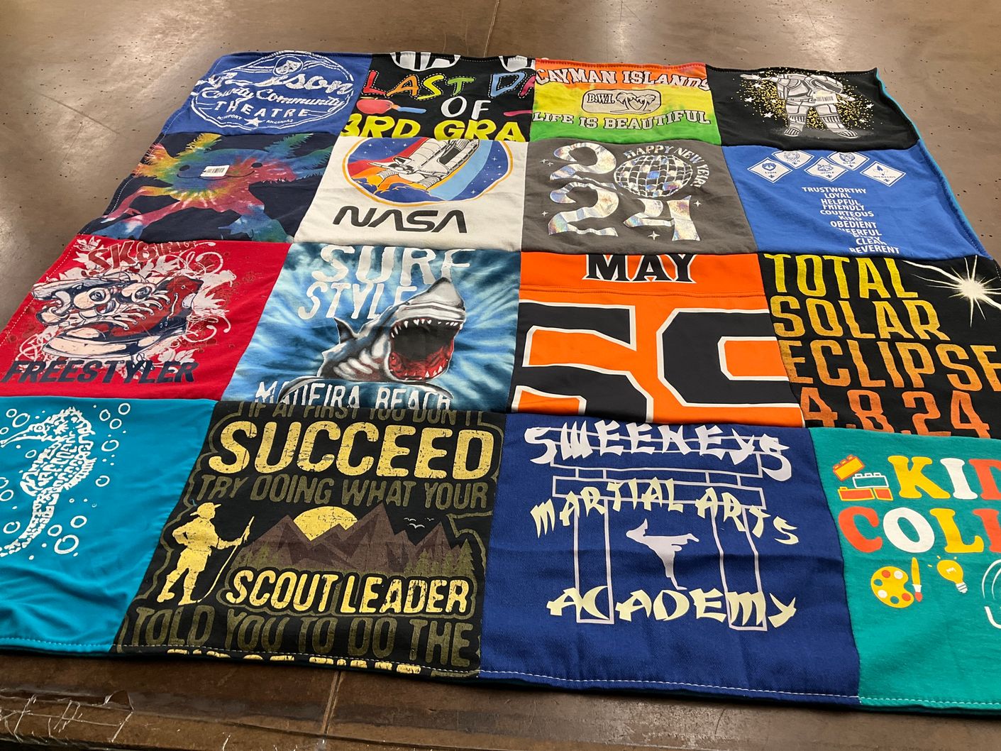 T-shirt quilt with theater, science themes by Loys from AR