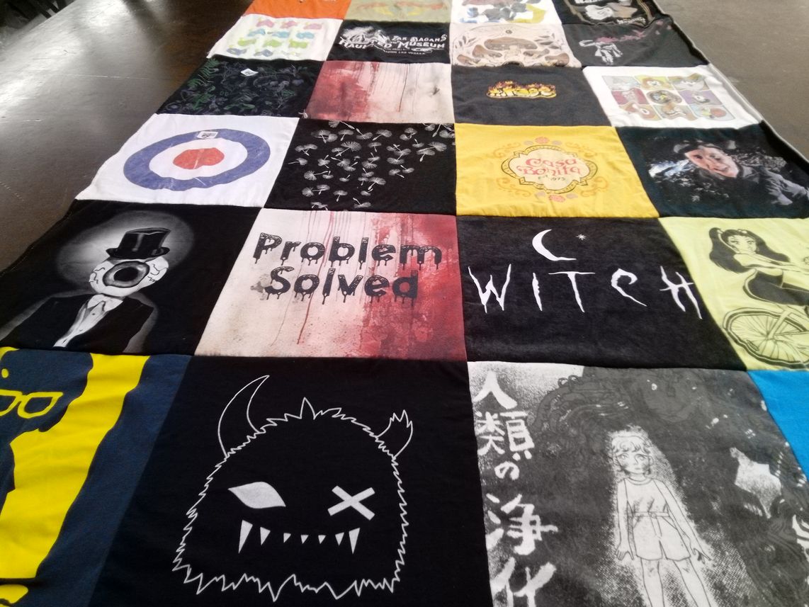 T-shirt quilt with art, music themes by Megan from CO