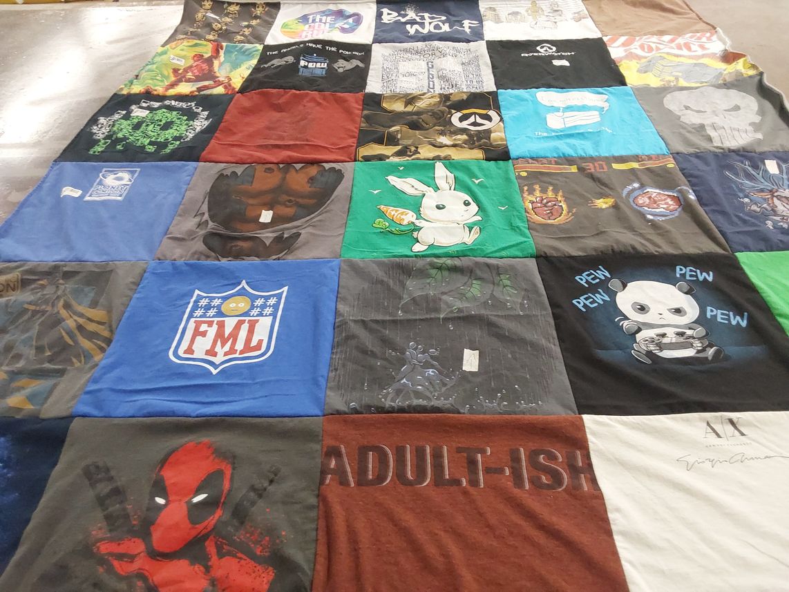 T-shirt quilt with comics, gaming themes by Rob from MO