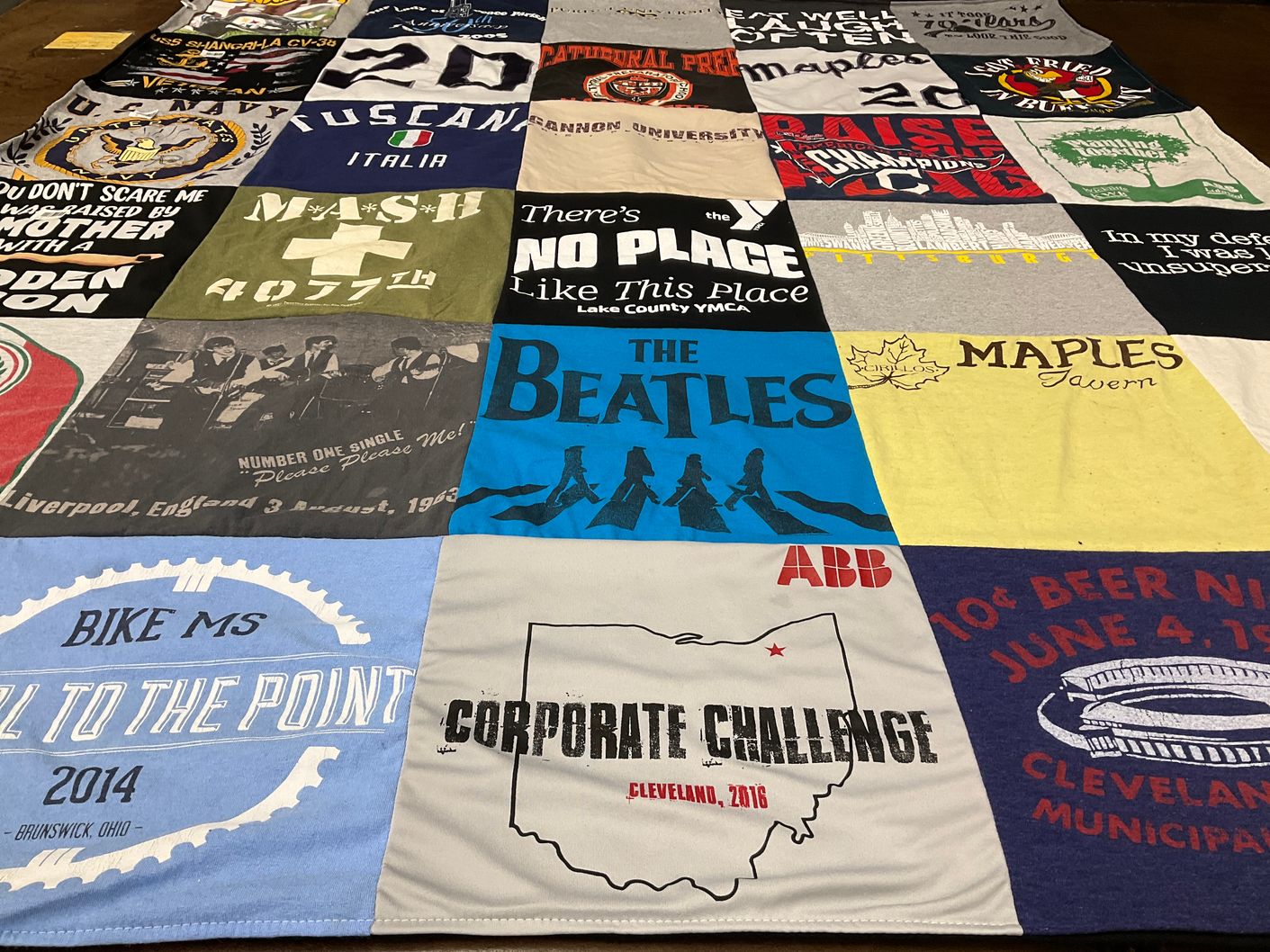 T-shirt quilt with music, cycling themes by John from OH