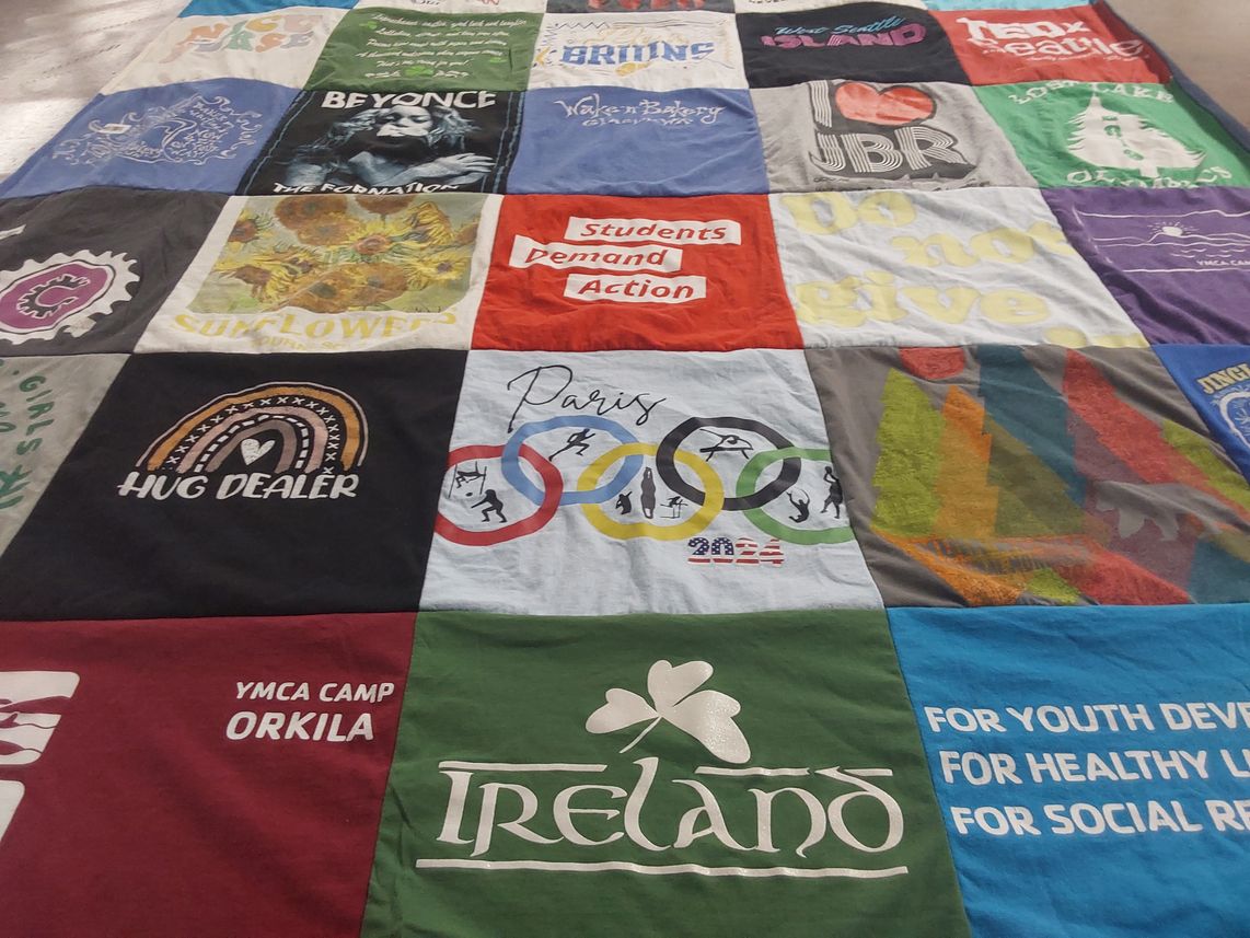 T-shirt quilt with music, activism themes by Leslie from WA