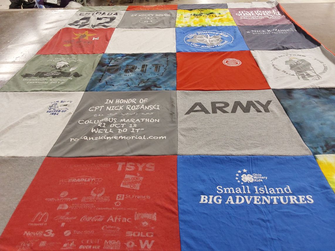 T-shirt quilt with military, running themes by Laura  from OH