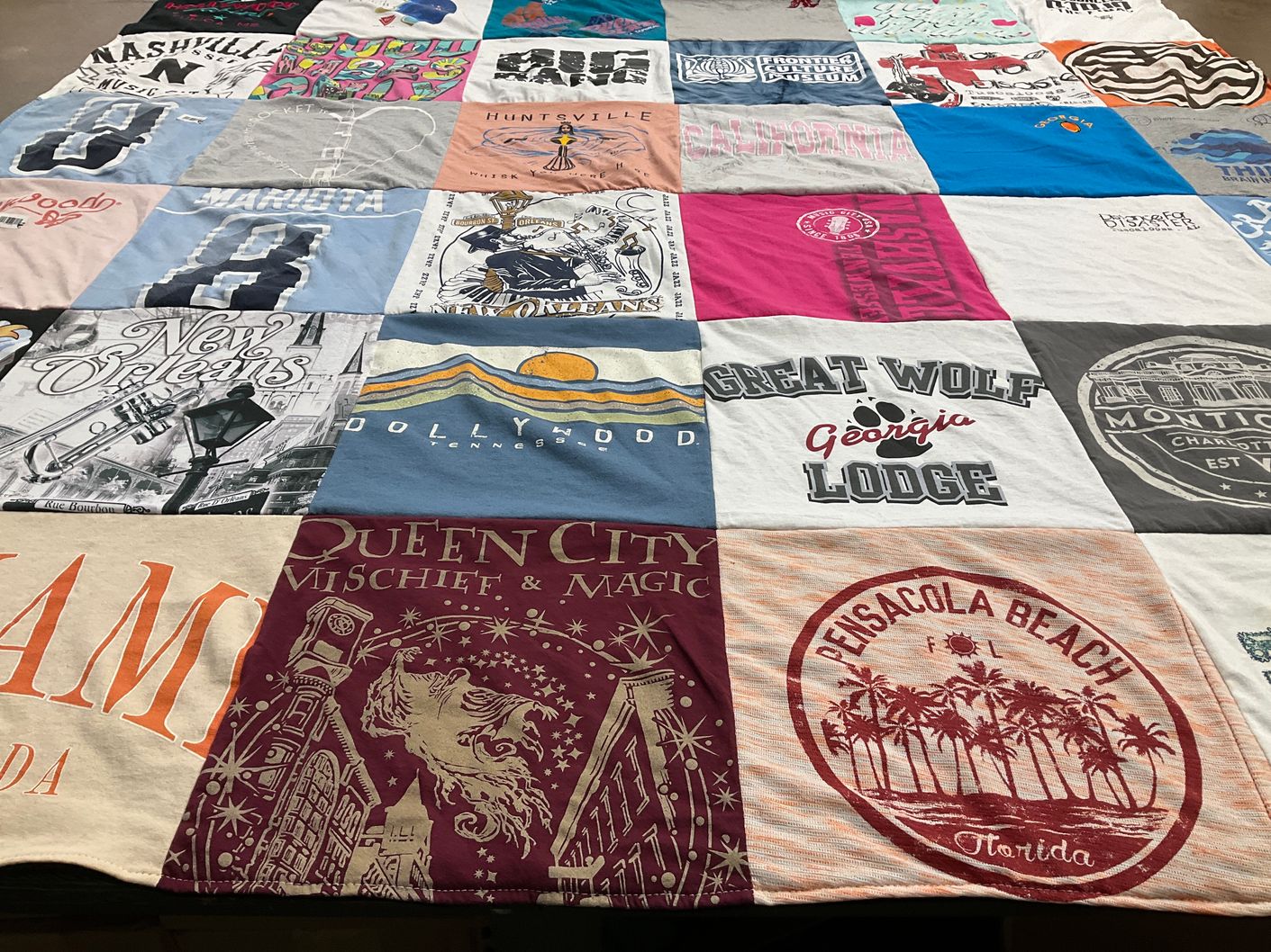T-shirt quilt with travel, tourism themes by Christina from AL