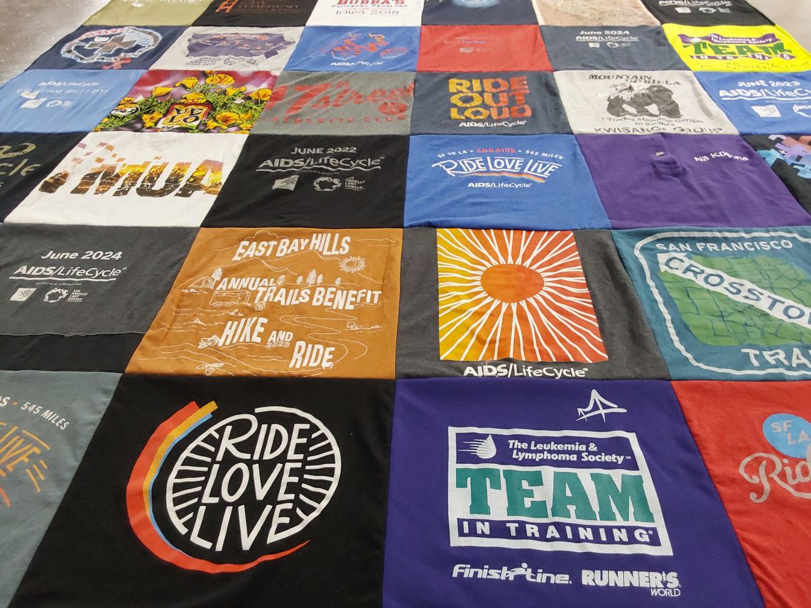 T-shirt quilt with cycling, charity events themes by karin from CA
