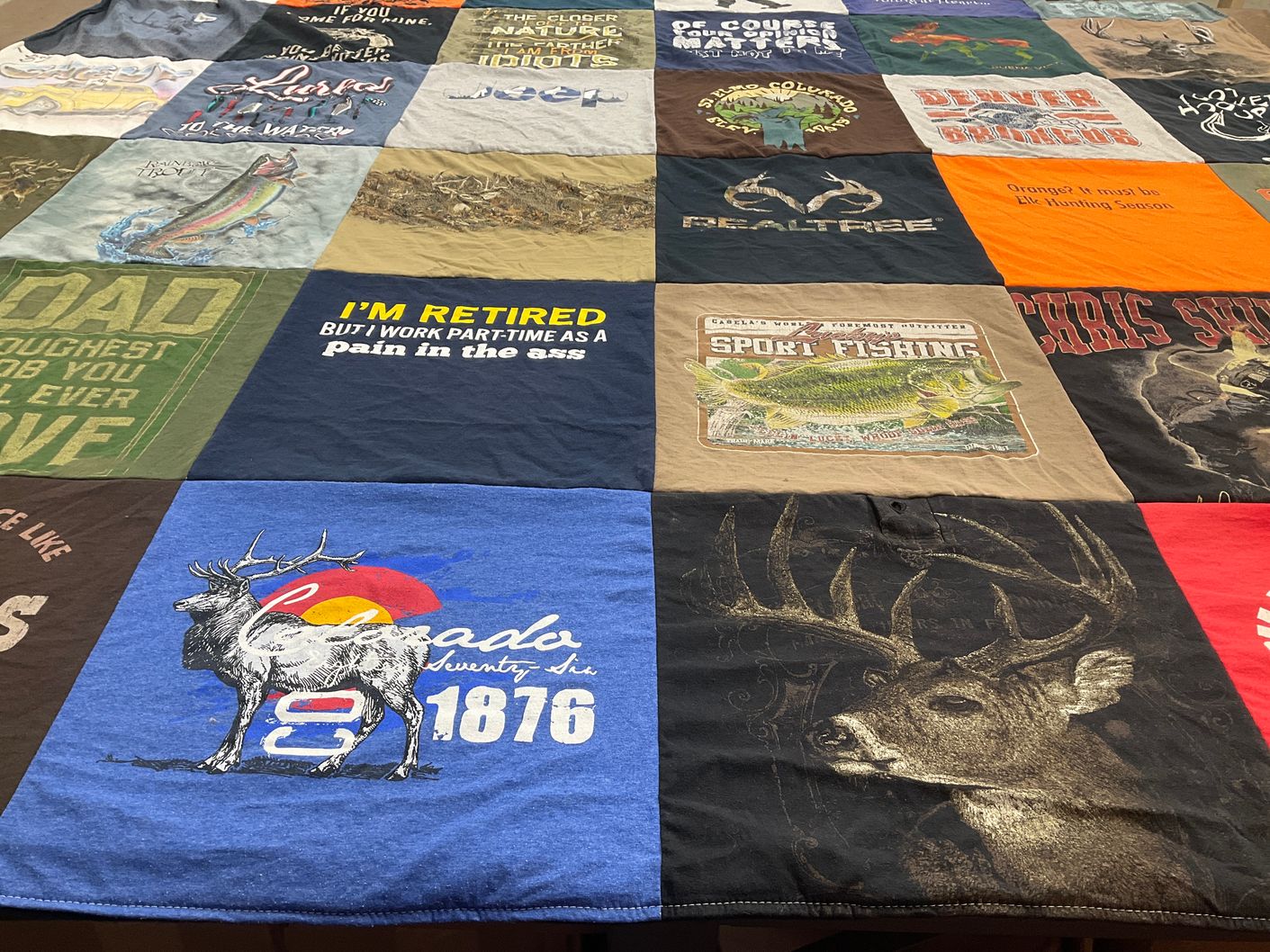 T-shirt quilt with hunting, fishing themes by Gina M from CO