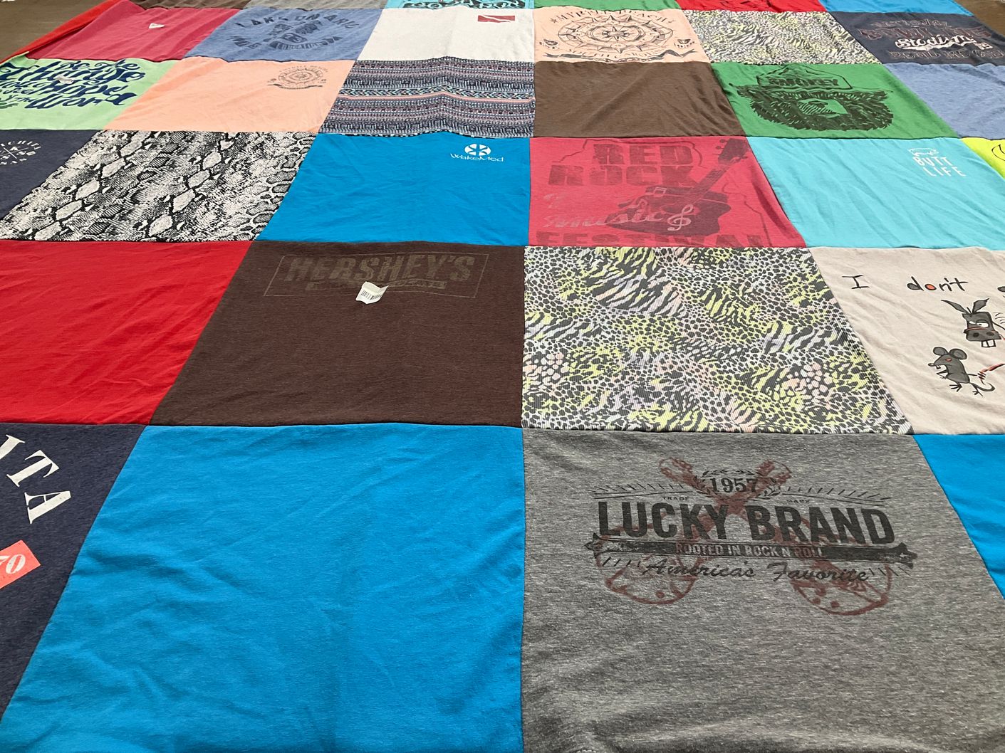 T-shirt quilt with travel, music themes by Kristin from NC