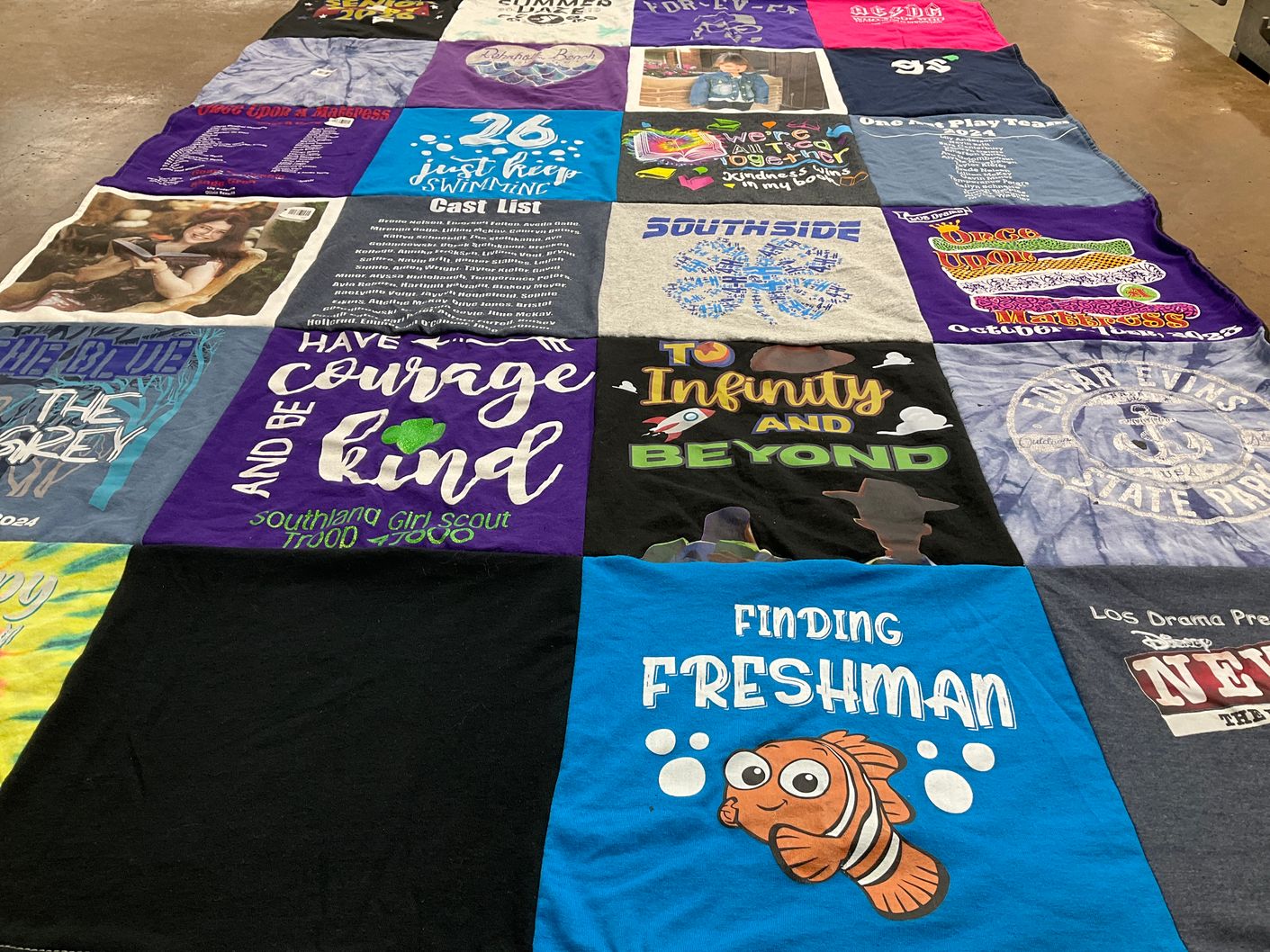 T-shirt quilt with theater, scouting themes by Laura from MN