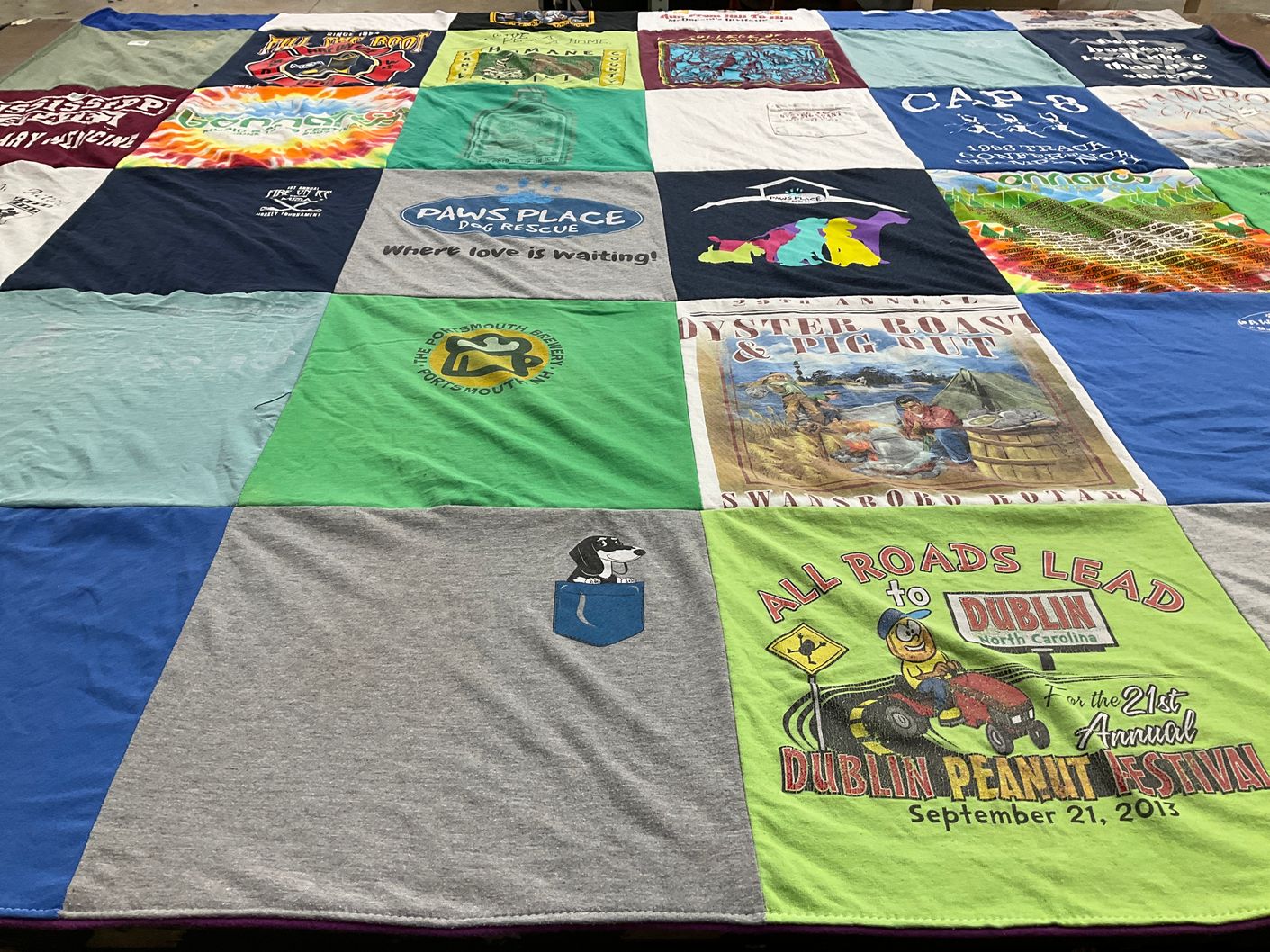 T-shirt quilt with dog rescue, festivals themes by Amy from NC