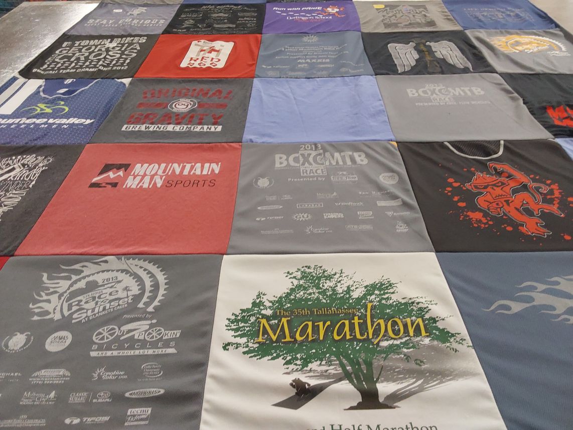 T-shirt quilt with cycling, brewing themes by Alison from OH