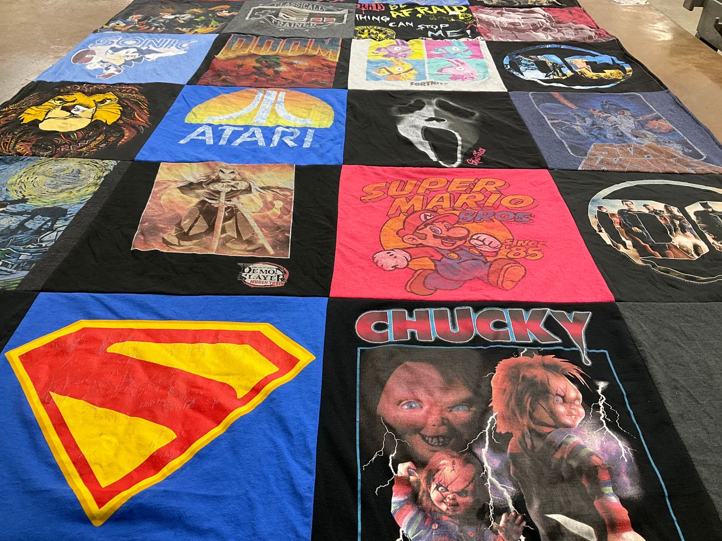 T-shirt quilt with video games, animation themes by April from OH