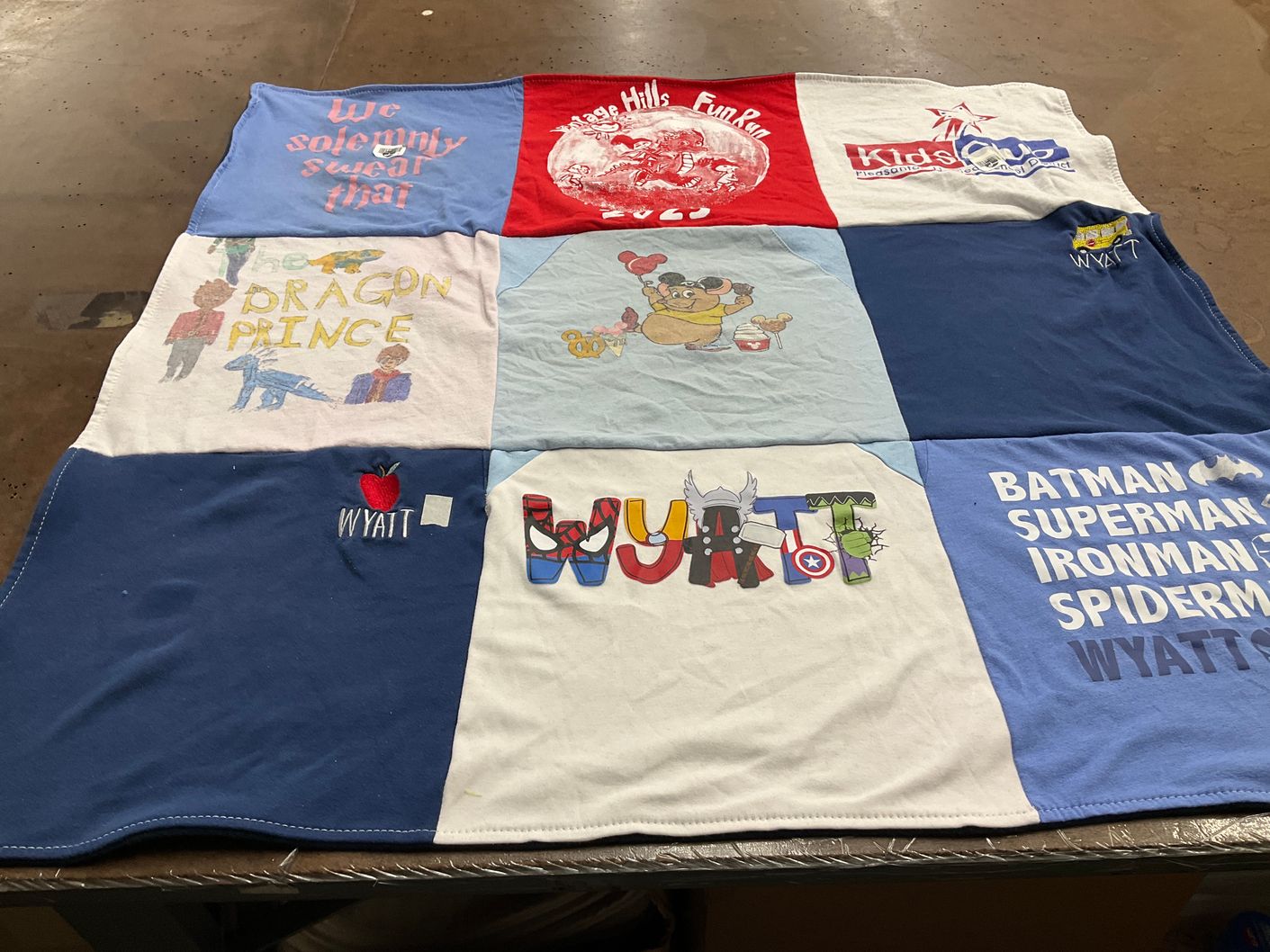 T-shirt quilt with superheroes, dragons themes by Tricia from CA