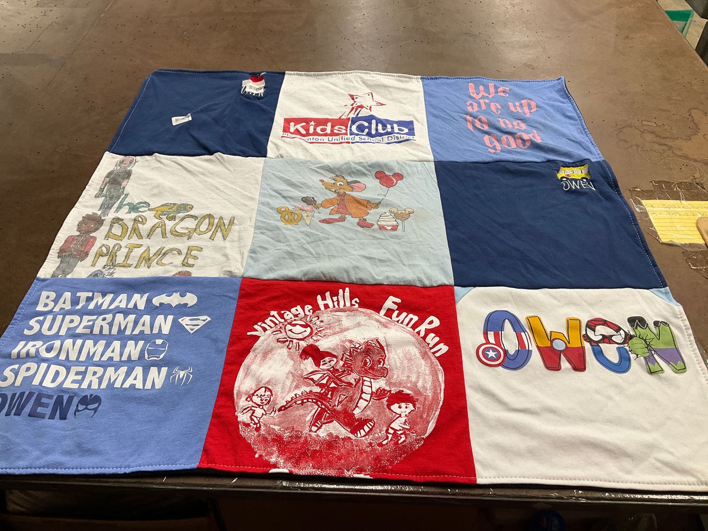T-shirt quilt with superheroes, fun runs themes by Tricia from CA