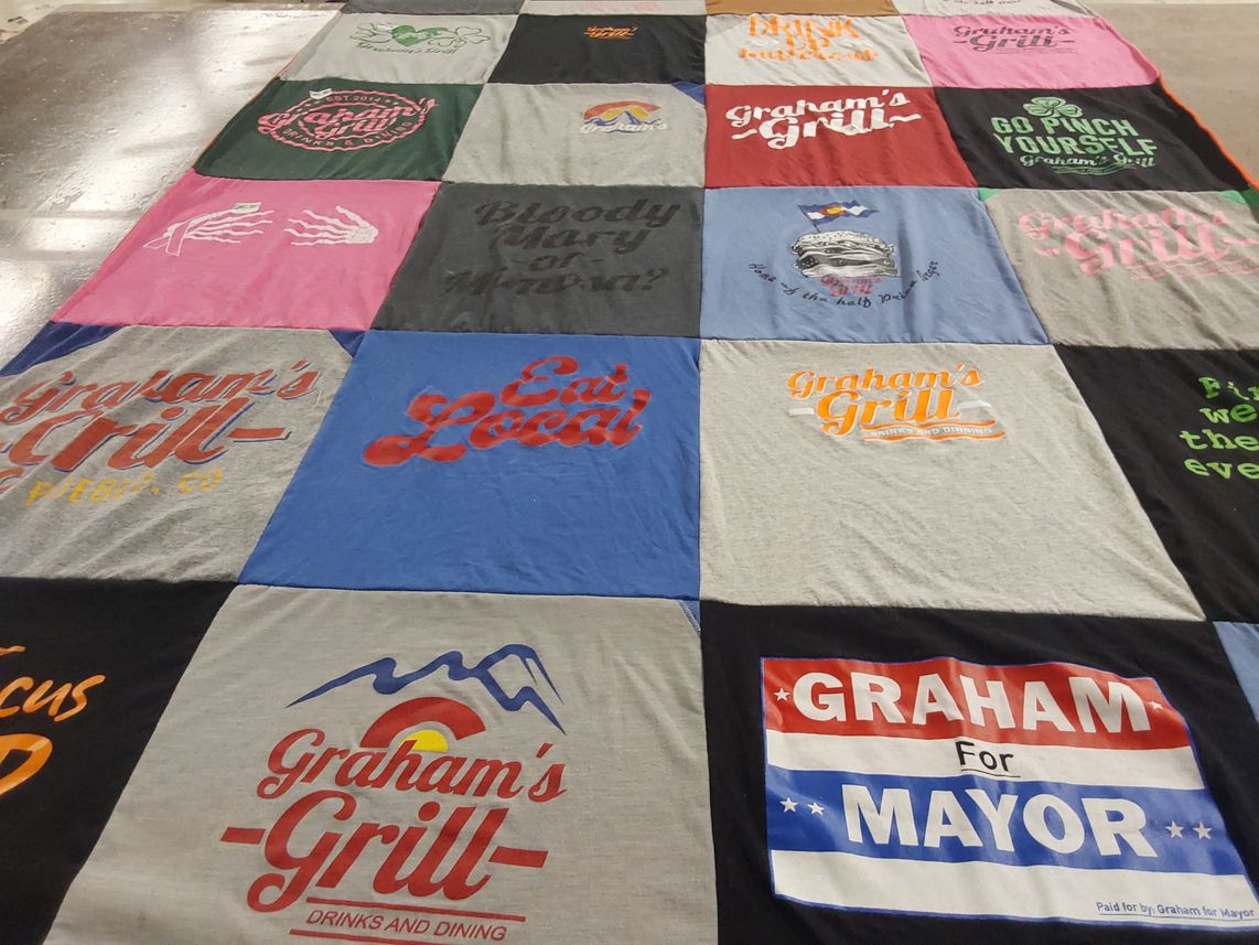 T-shirt quilt with local dining, politics themes by Pamela from CO
