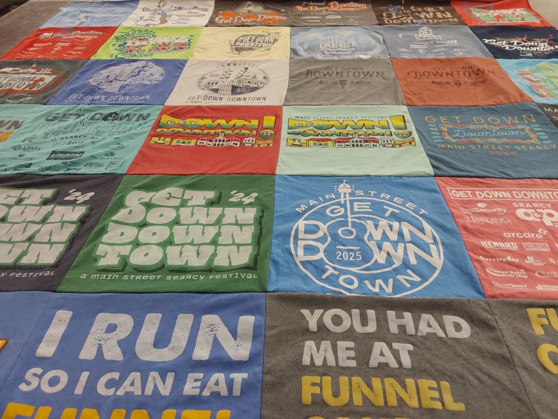 T-shirt quilt with local events, community festivals themes by Denise from AR