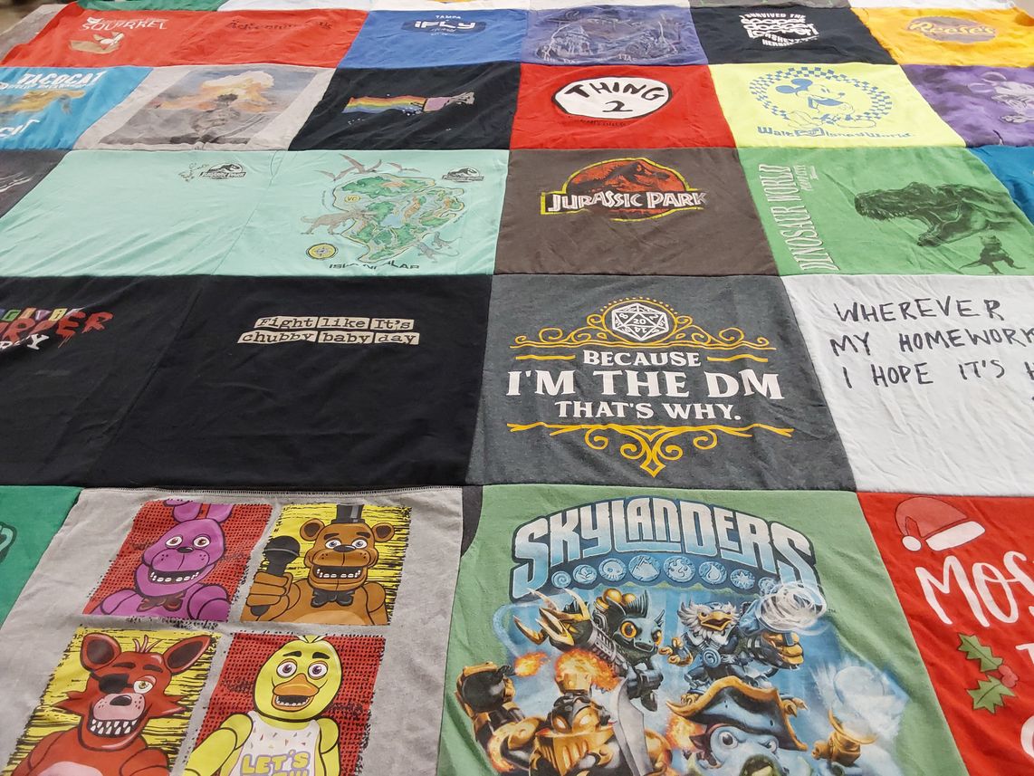 T-shirt quilt with gaming, dinosaurs themes by Toni from NC