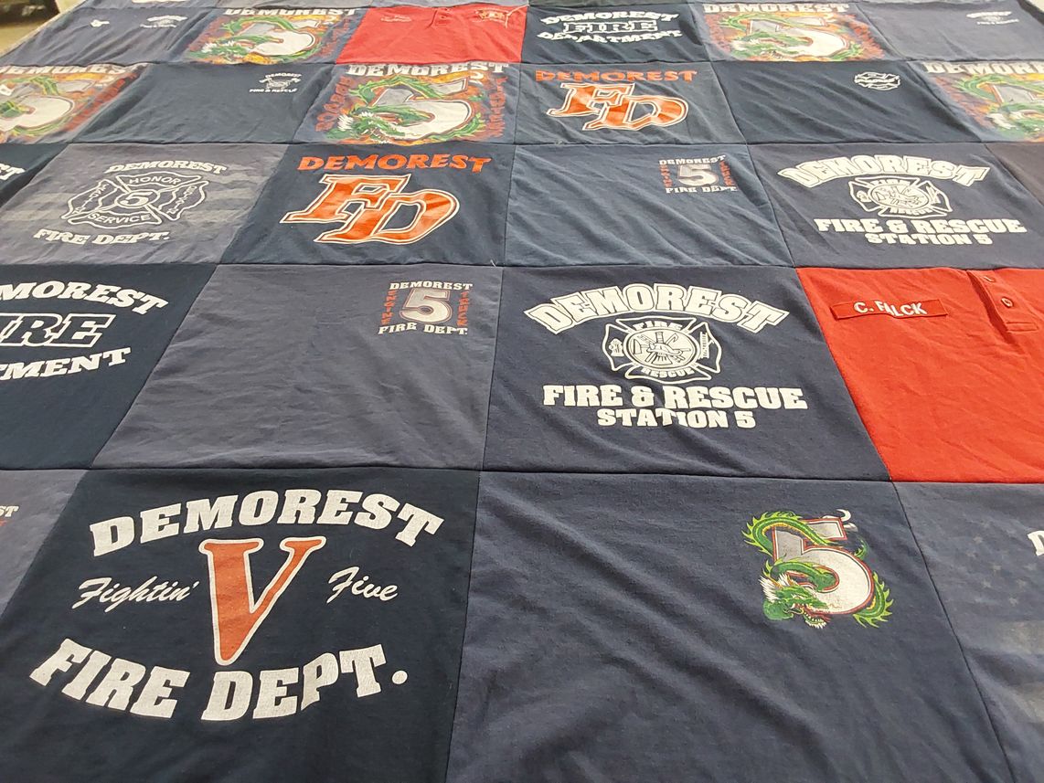 T-shirt quilt with firefighting, community service themes by Brenda from GA