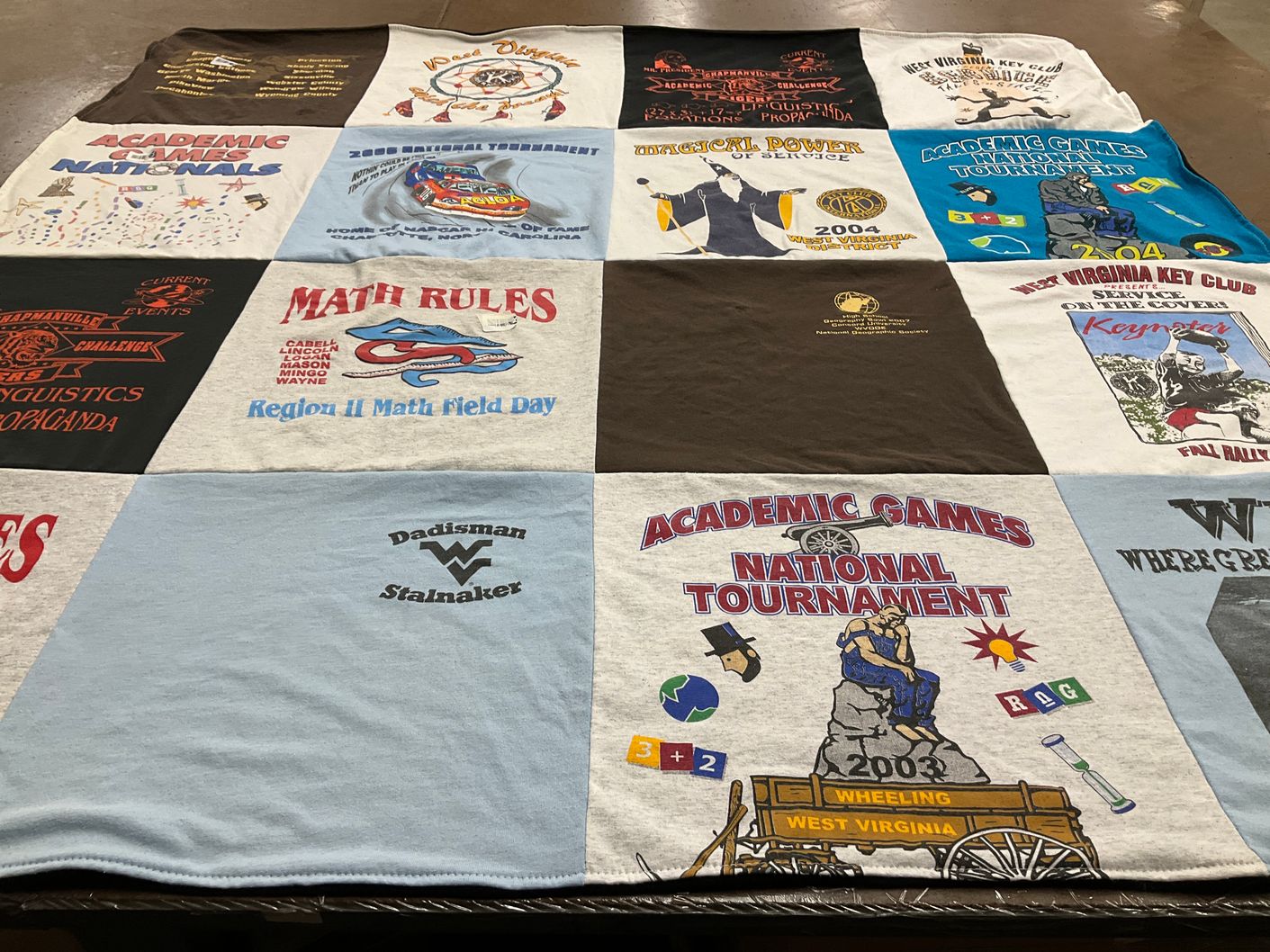 T-shirt quilt with academic competitions, math themes by Havilah from SC