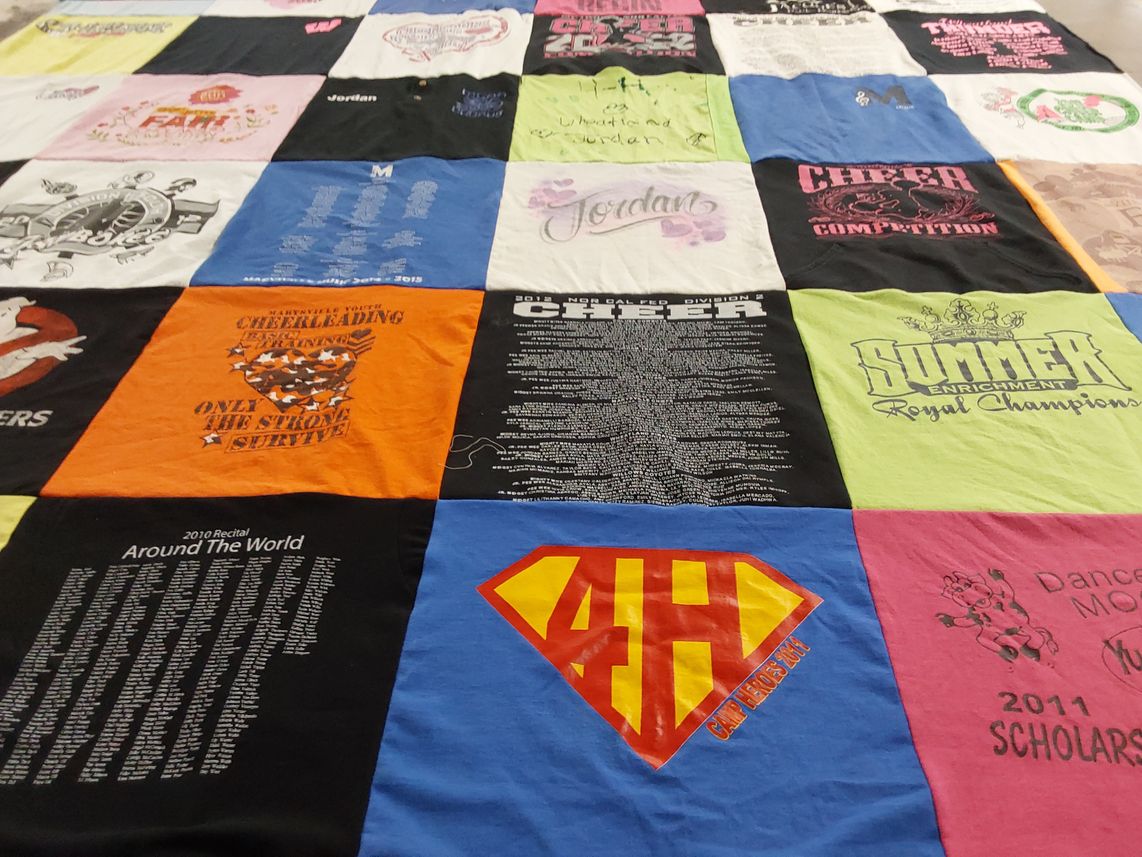 T-shirt quilt with cheerleading, dancing themes by Brenda from CA