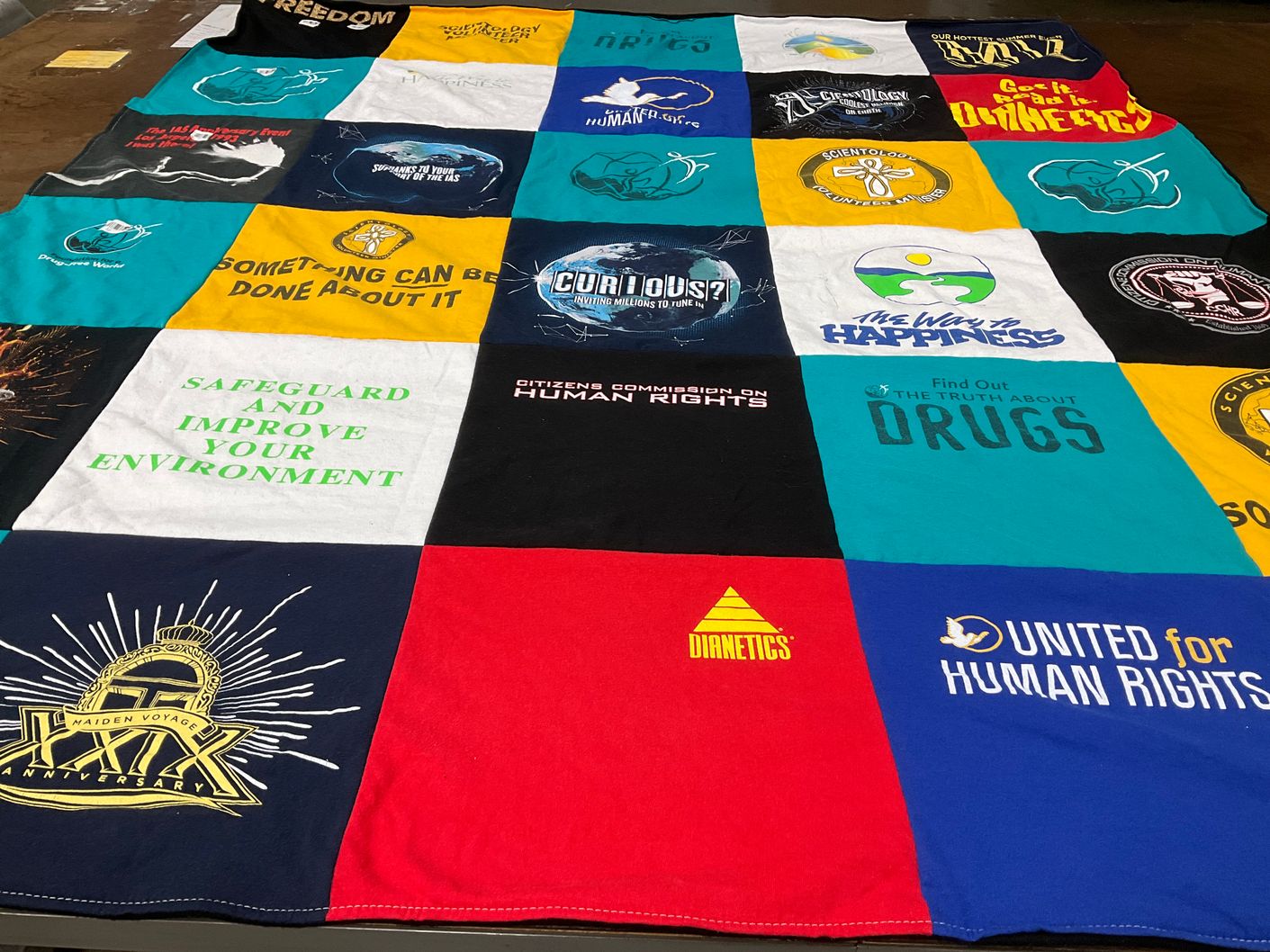 T-shirt quilt with human rights, environmental awareness themes by Janel from KY