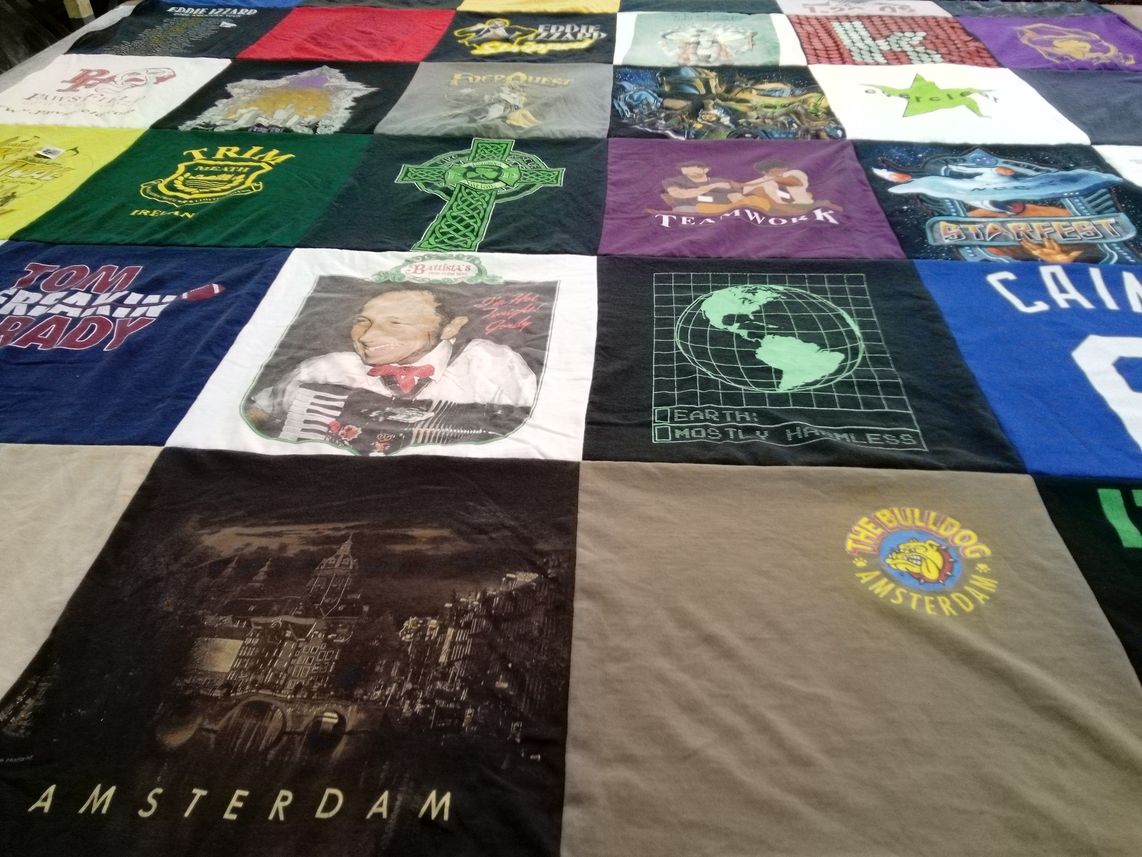 T-shirt quilt with music, travel themes by Carolyn from IL