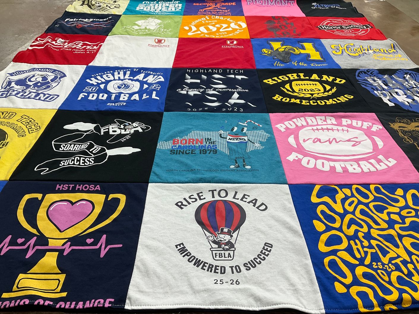 T-shirt quilt featuring powder puff rams football by KARA from NC