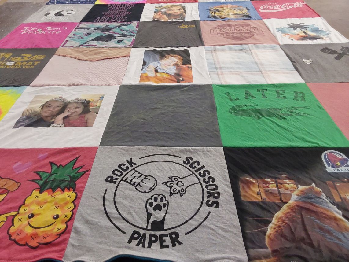 T-shirt quilt with family, games themes by Keri from WA