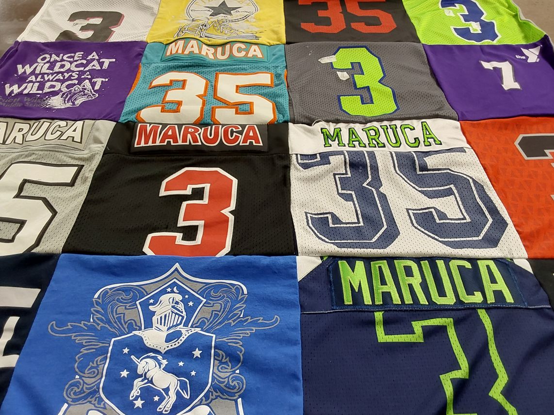 T-shirt quilt with sports themes by Elizabeth from TX