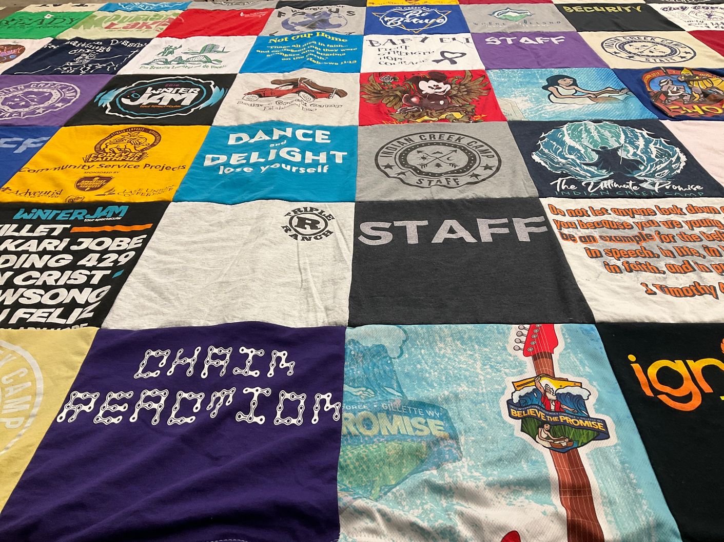 T-shirt quilt with community service, youth programs themes by Stella from KY
