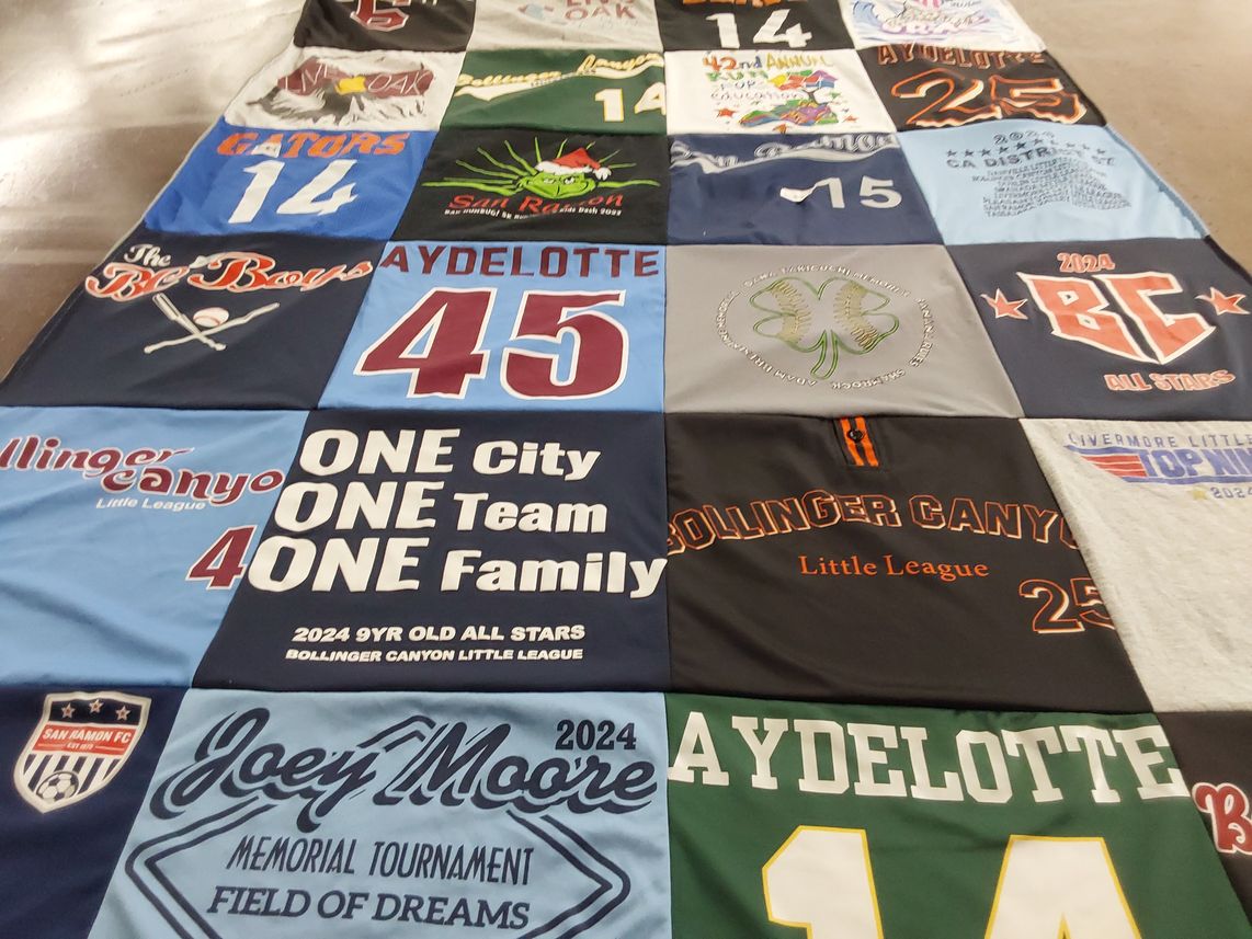 T-shirt quilt with youth sports, community themes by Jeanna from CA