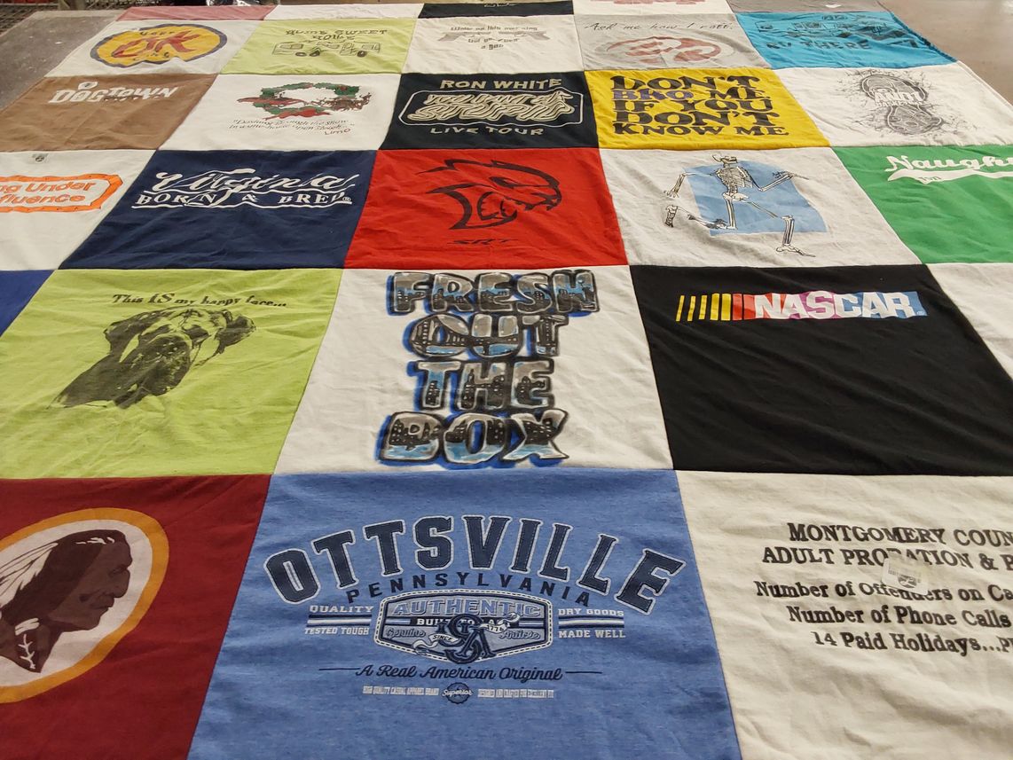 T-shirt quilt with nascar, motorcycling themes by Leslie from PA