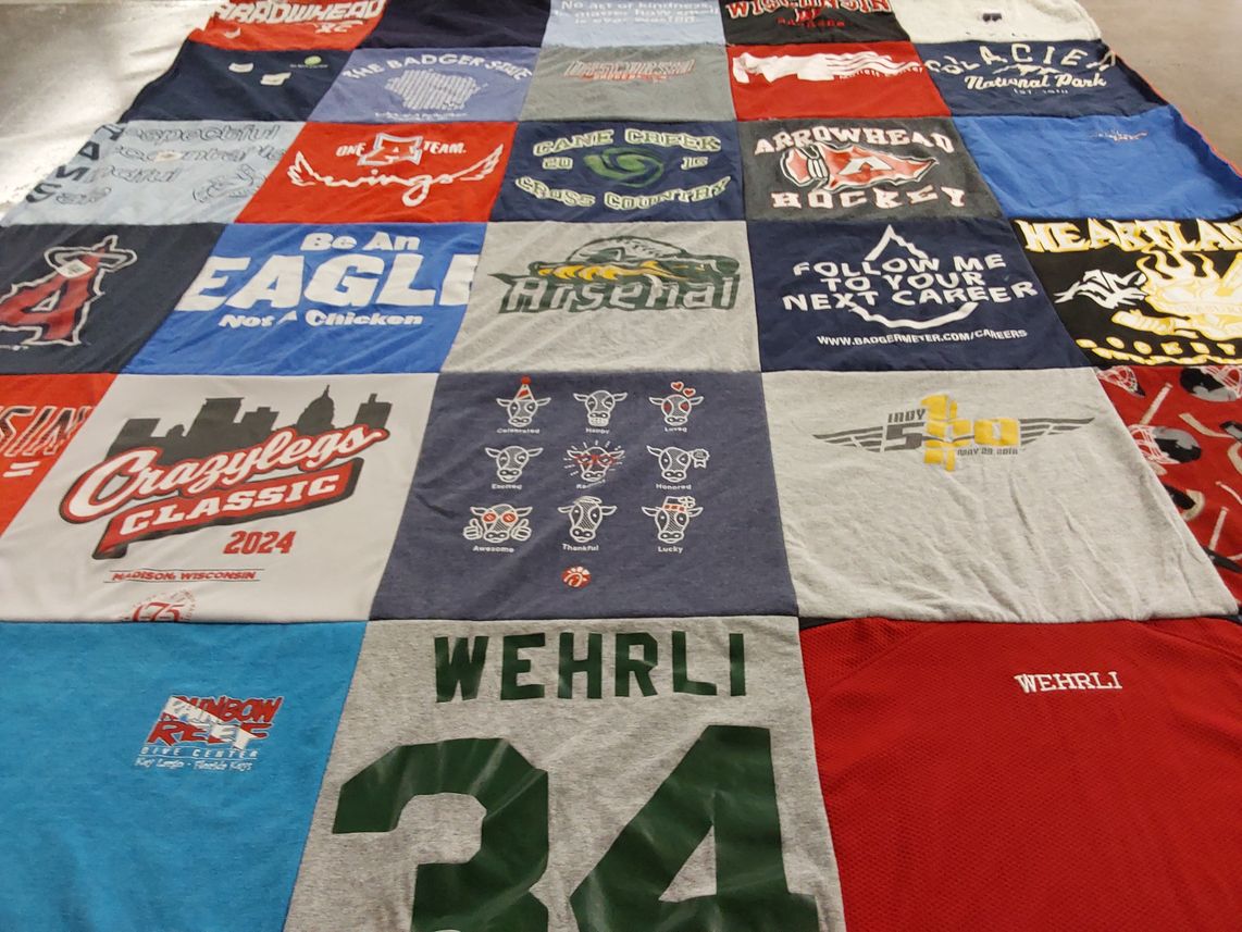T-shirt quilt with sports, career themes by Judith from WI