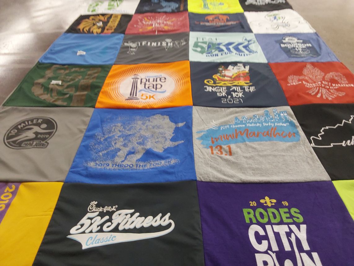 T-shirt quilt with running, sports themes by Thomas from KY