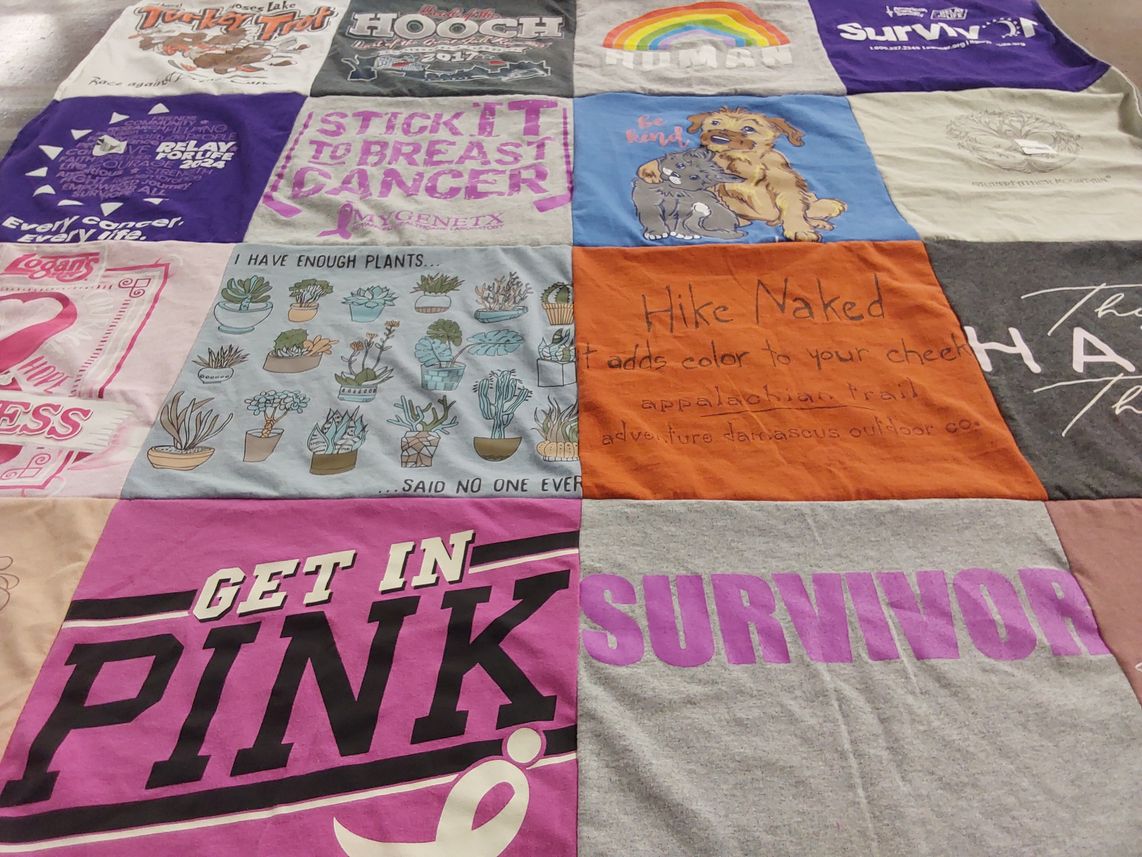 T-shirt quilt with breast cancer awareness, hiking themes by Regina from GA