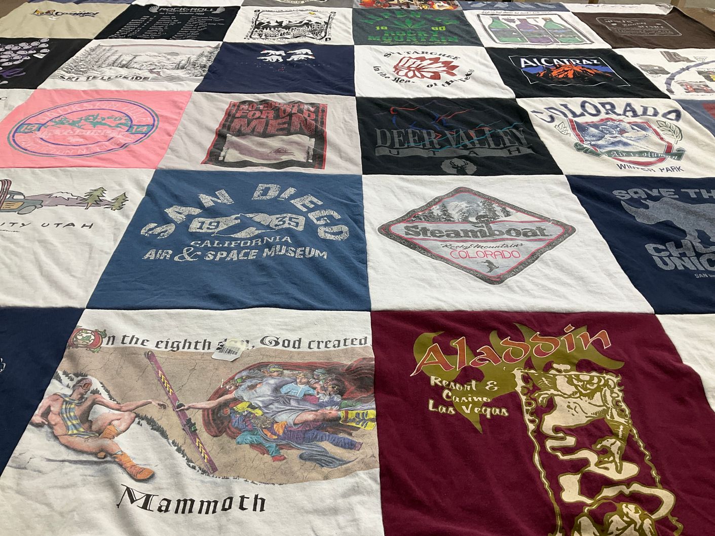 T-shirt quilt with skiing, travel themes by Katherine from IL