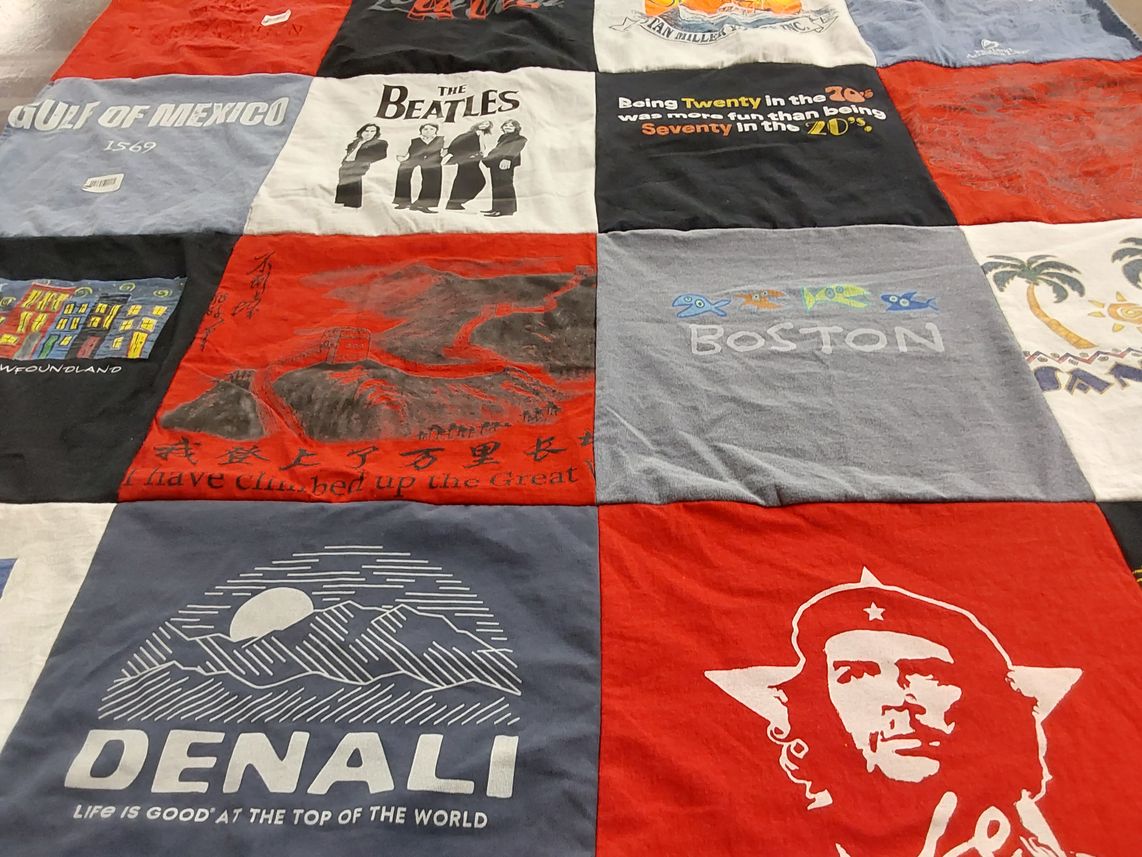 T-shirt quilt with music, travel themes by Cynthia from CA
