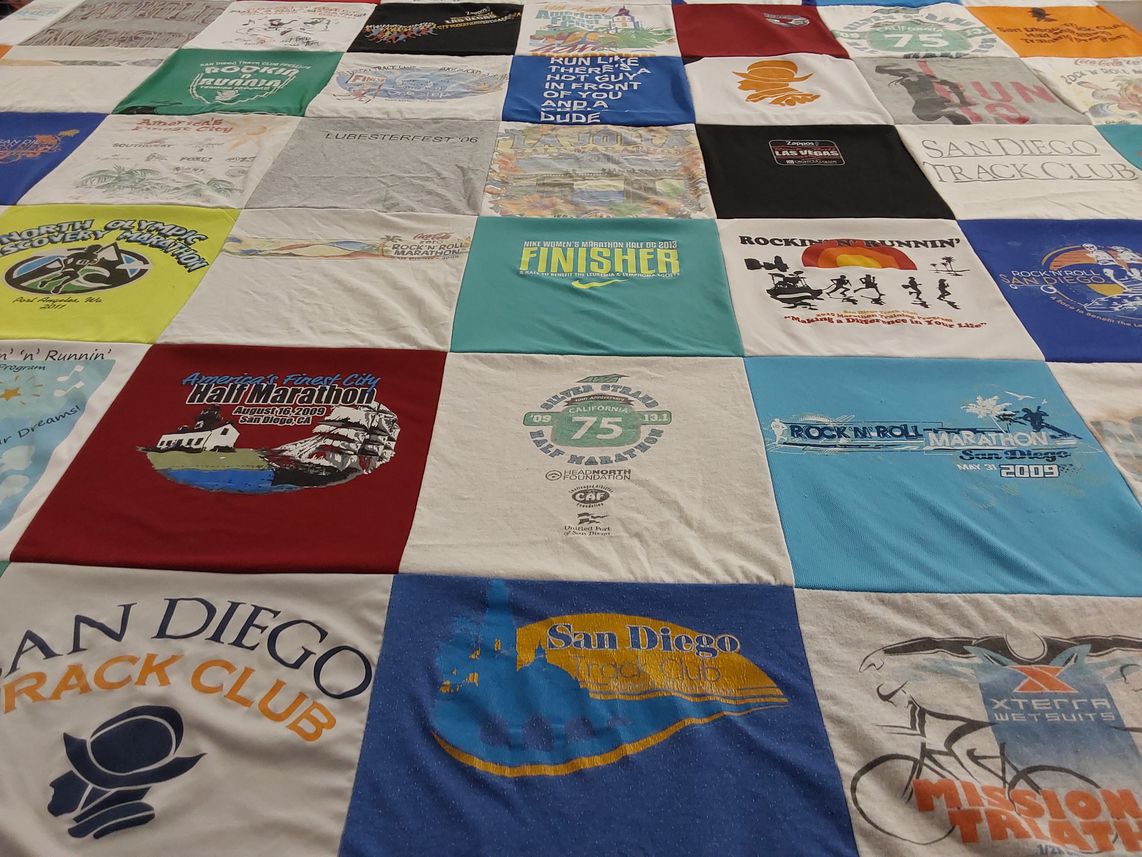 T-shirt quilt with running, biking themes by Christina from CA