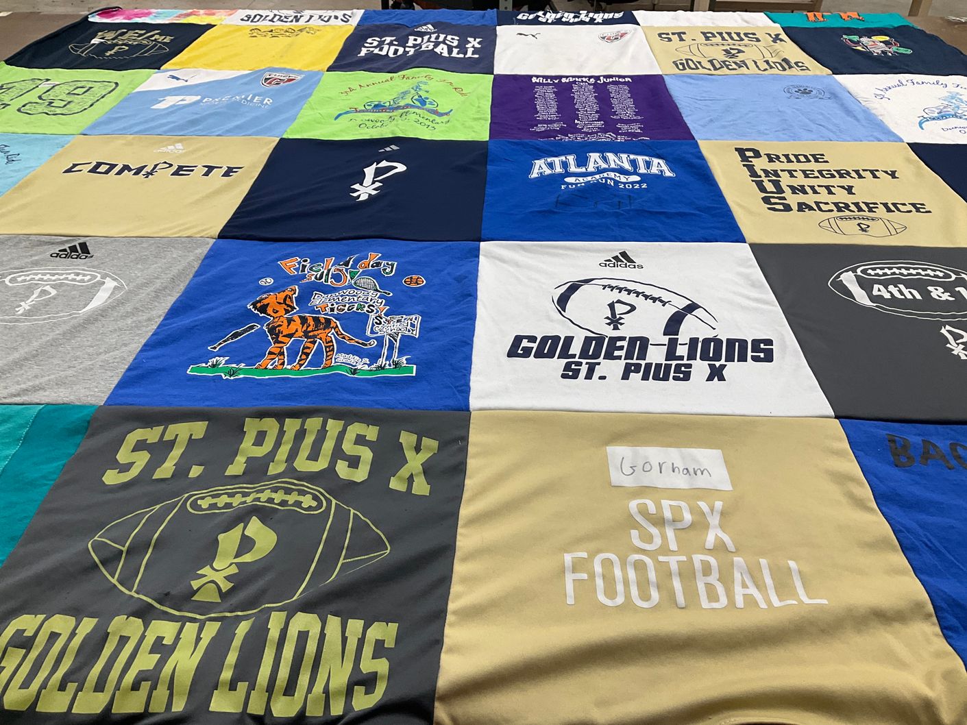 T-shirt quilt featuring golden lions by Rosemary from GA
