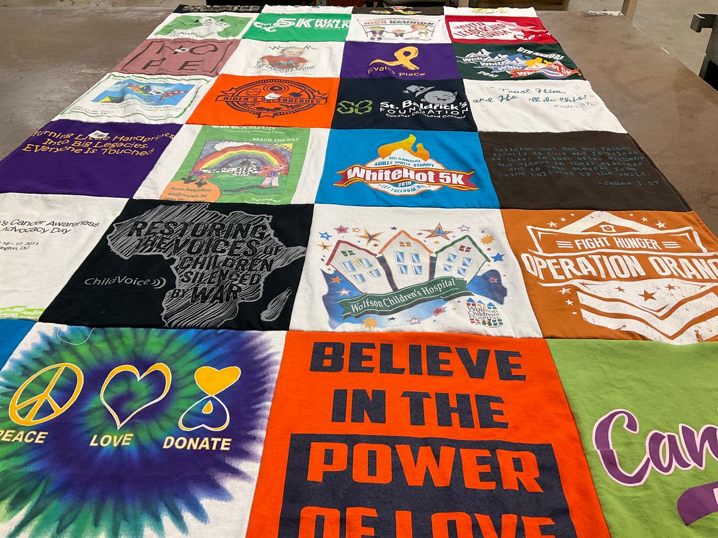 T-shirt quilt with charity, community service themes by JOANNE from OH